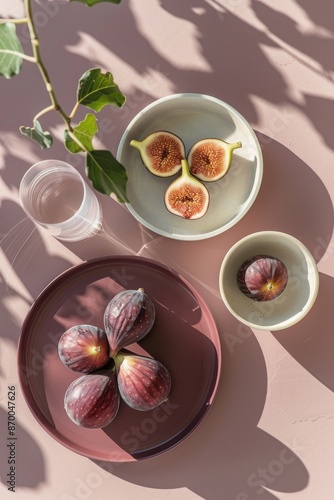 Fresh Figs on a Pink Tray With a Glass of Water and Sunlight