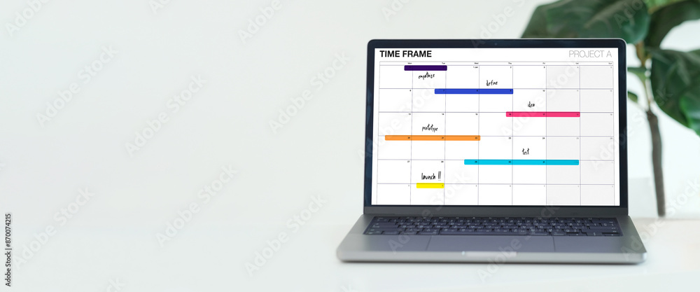 Laptop computer with timeline project schedule, work plan mangement, on table work with copy space Laptop computer with timeline project schedule, work plan mangement, on table work with copy space