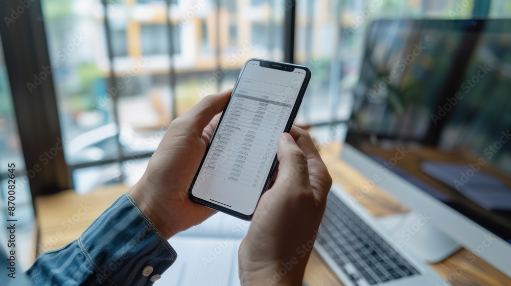 Digital Document Control: Businessman Reviewing Checklist and Filing Form on Smartphone and Computer for Project Approval and Feedback Rating - Wide Banner Digital Document Control: Businessman Reviewing Checklist and Filing Form on Smartphone and Computer for Project Approval and Feedback Rating - Wide Banner