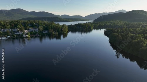 Approaching aerial view of Mirror Lake and Lake Placid in Lake Placid, New York