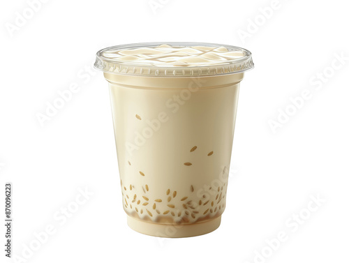 A close-up of a clear plastic cup filled with a creamy, beige drink. Tiny white grains, resembling rice, are visible throughout the beverage.