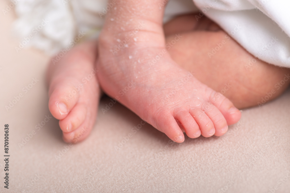 Little newborn baby human feet with toes and toenails close up Little newborn baby human feet with toes and toenails close up
