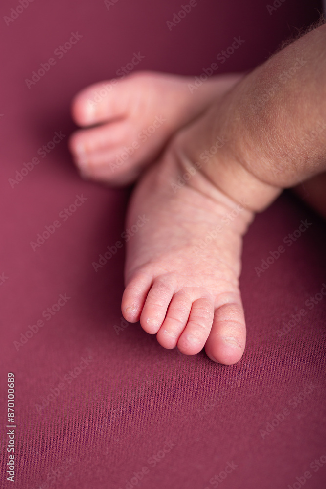 Little newborn baby human feet with toes and toenails close up Little newborn baby human feet with toes and toenails close up