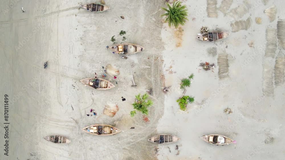Aerial top view of boats kept idle on beach. Drone shot. Aerial top view of boats kept idle on beach. Drone shot.