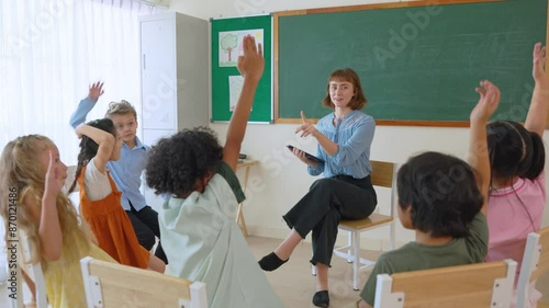 Caucasian young woman teacher teaching student in classroom at school.