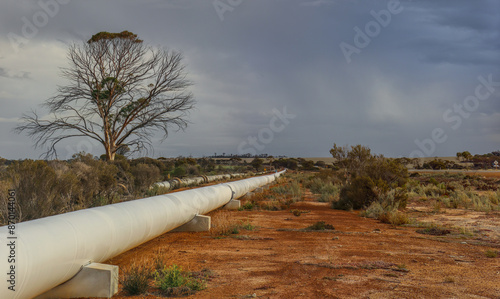 A thunderstorm approaches the CY O'Connor water pipeline from Perth to Kalgoorlie Western Australia, near Southern Cross.