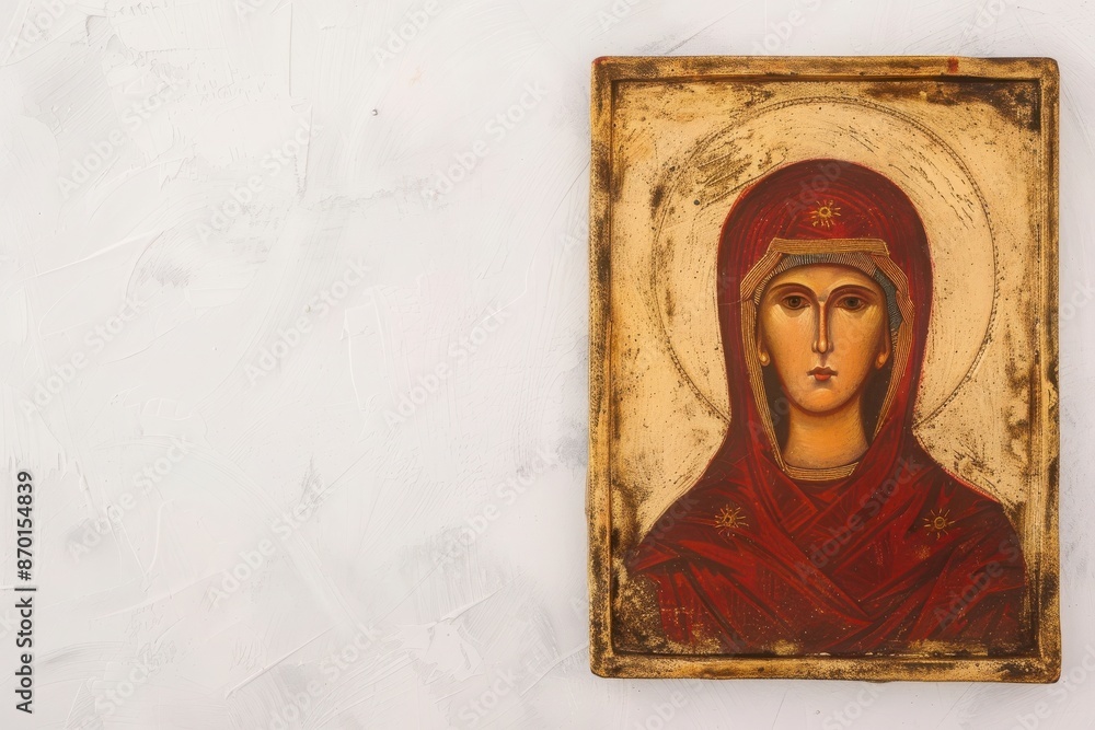 Fototapeta premium Vintage religious icon painting depicting a saint, displayed on a textured white wall with ample copy space.