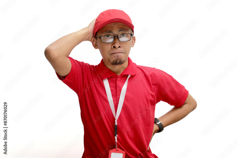 Shocked and anxious Asian delivery man or courier is captured in a moment of panic, grabbing his head with both hands and displaying a worried expression. Isolated on a white background, Shocked and anxious Asian delivery man or courier is captured in a moment of panic, grabbing his head with both hands and displaying a worried expression. Isolated on a white background,