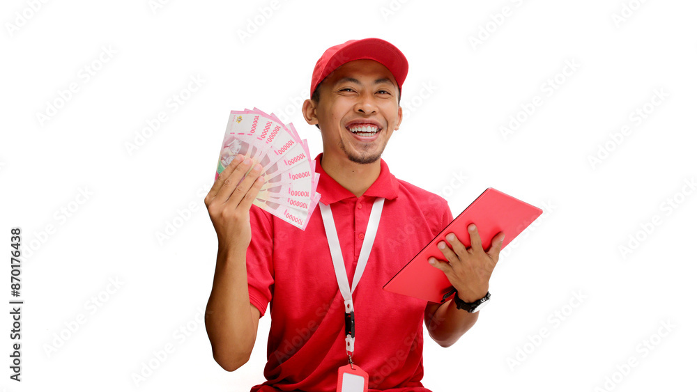 Asian delivery man or courier confidently shows money in his hand to the camera while holding a tablet, isolated on a white background. Concepts of financial success, Logistics and delivery services Asian delivery man or courier confidently shows money in his hand to the camera while holding a tablet, isolated on a white background. Concepts of financial success, Logistics and delivery services
