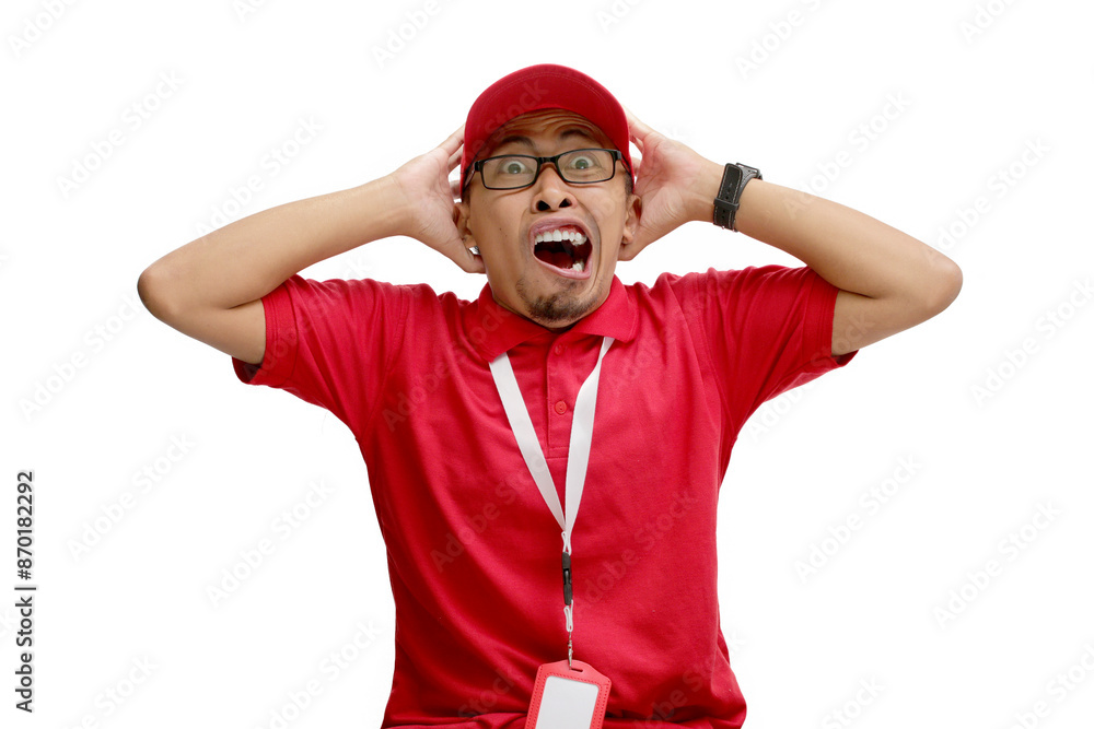 Shocked Asian delivery man grabs his head, reacting to unexpected news, a limited offer, or great deals. Isolated on a white background, Concept of unexpected news, special offers, and great deals Shocked Asian delivery man grabs his head, reacting to unexpected news, a limited offer, or great deals. Isolated on a white background, Concept of unexpected news, special offers, and great deals