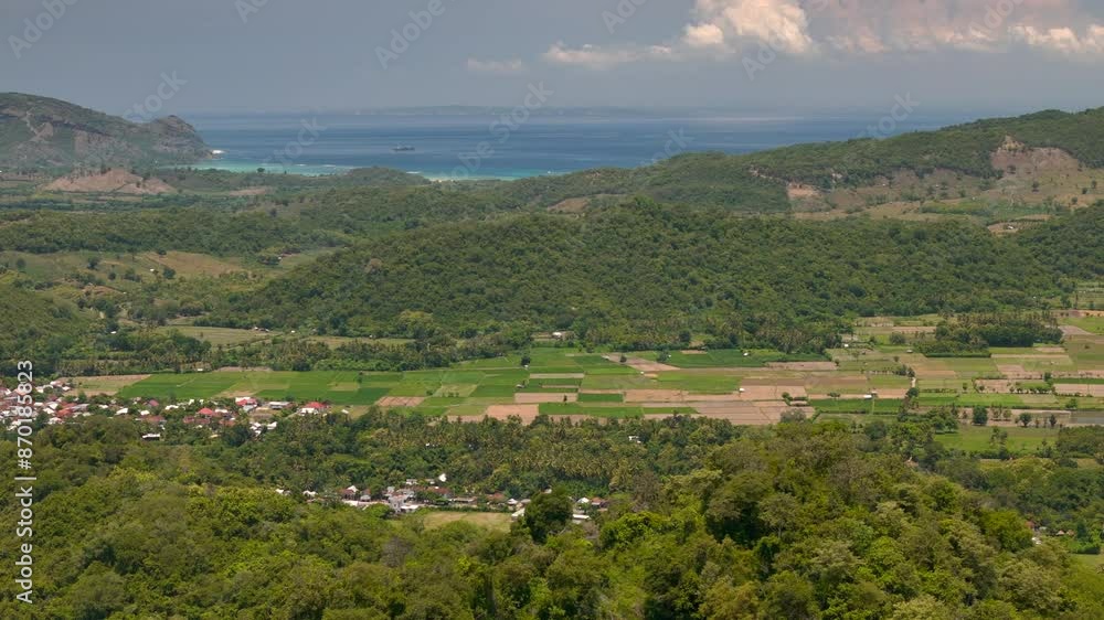 Aerial drone view of Sumbawa colourful rice fields and green hills. Attraction of lombok. Travel destination. Indonesia Aerial drone view of Sumbawa colourful rice fields and green hills. Attraction of lombok. Travel destination. Indonesia