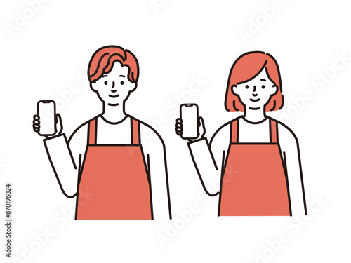 スマホを持つエプロン姿の男女
