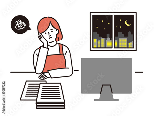 残業をするエプロン姿の女性