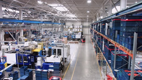 Modern industrial warehouse with machinery and shelves for efficient operations and logistics