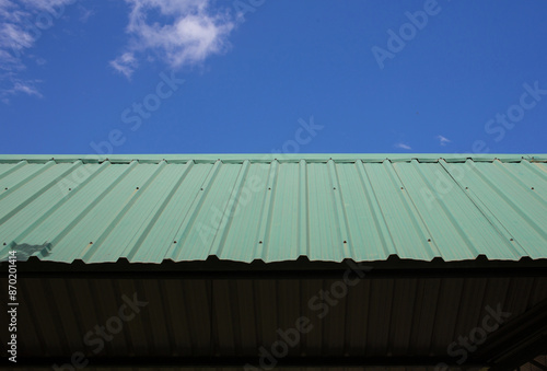 Wallpaper Mural Green metal sheet roof, blue sky background. Torontodigital.ca