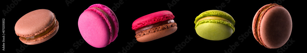Macro photo of french caramel macaroon or macaron isolated on black background Macro photo of french caramel macaroon or macaron isolated on black background