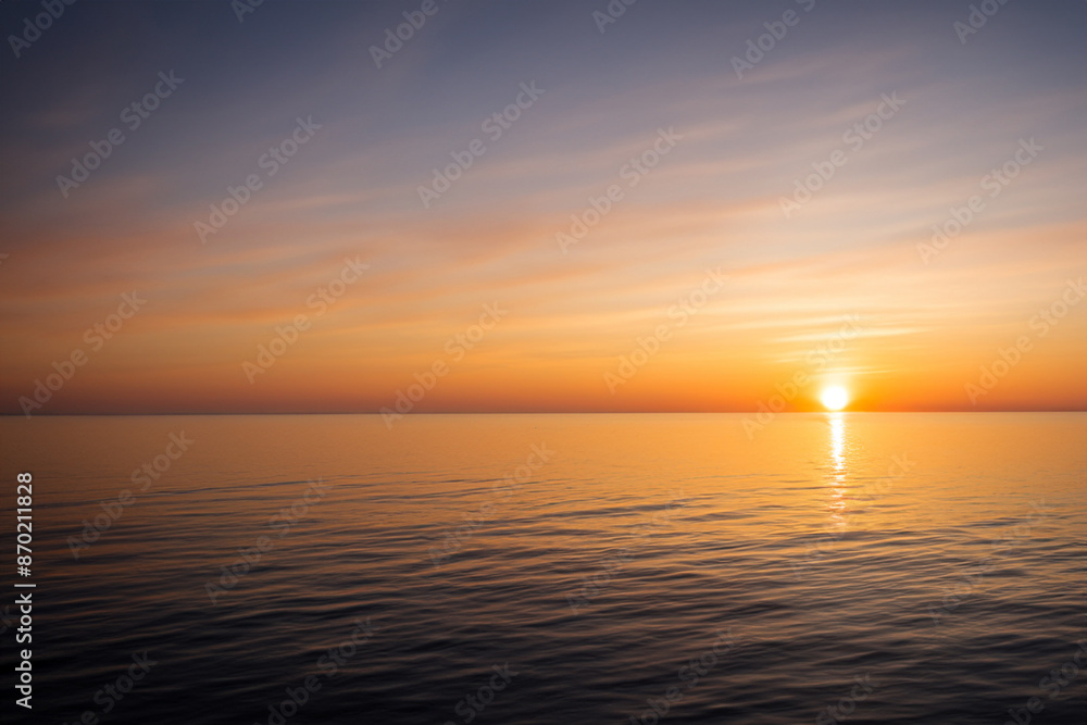 Obraz premium Sunset over the sea with horizon. Ocean landscape beach concept. Sun at sunset in the sky and sea. Sun at sunset on the horizon with sea and clouds lifestyle.