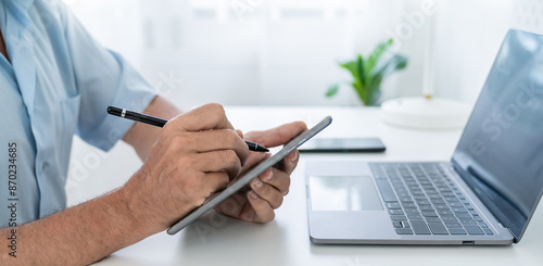 Wallpaper Mural Close up of happy caucasian business senior man casual cloths shirt work from home office desk using pencil draw tablet. Small business employee freelance online sme marketing e-commerce banner Torontodigital.ca