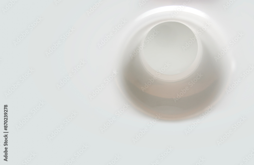 round hole in white plastic surface close up round hole in white plastic surface close up