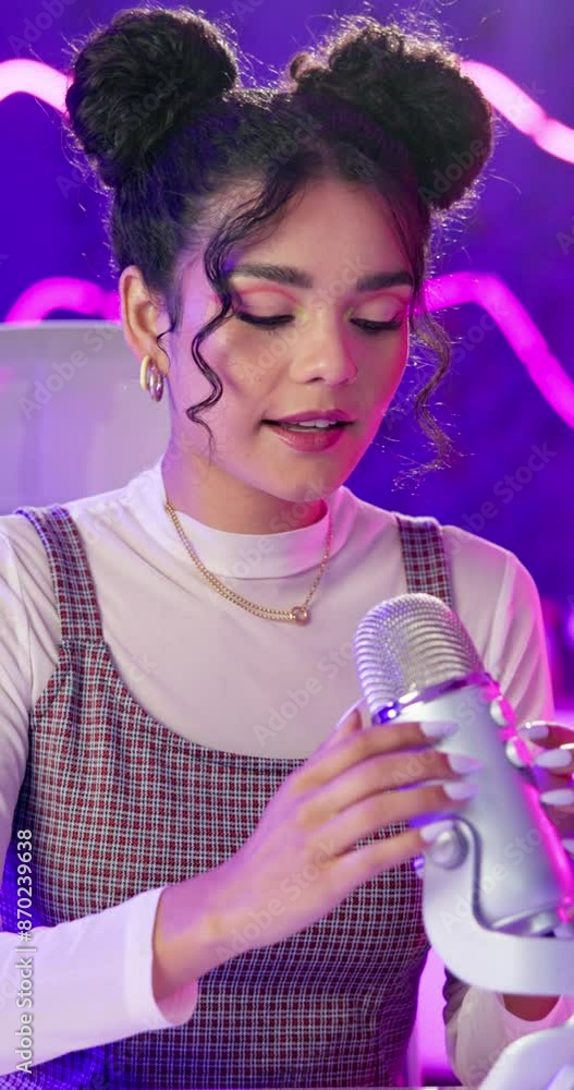 Woman, podcast and hands on microphone on neon background for audio or sound therapy and ASMR. Woman, influencer and live streaming for sleeping or mental health and sensation for relaxation or calm Woman, podcast and hands on microphone on neon background for audio or sound therapy and ASMR. Woman, influencer and live streaming for sleeping or mental health and sensation for relaxation or calm
