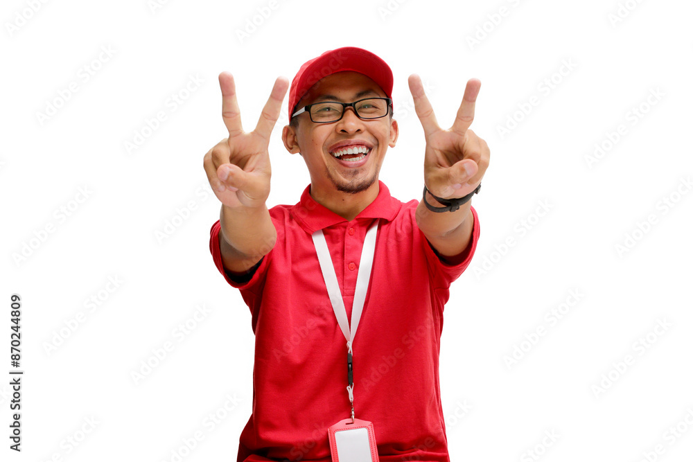 Attractive Asian delivery man or courier showing a peace gesture or V sign to the camera, isolated on a white background Attractive Asian delivery man or courier showing a peace gesture or V sign to the camera, isolated on a white background