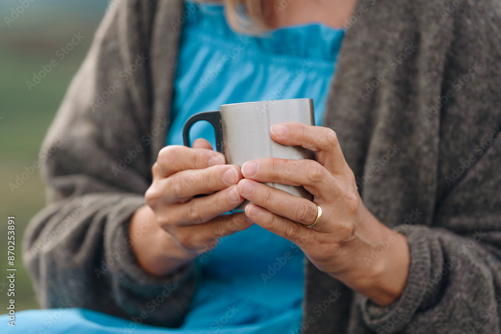 Close Up of Womans Hands Holding Mug in Public Park Close Up of Womans Hands Holding Mug in Public Park