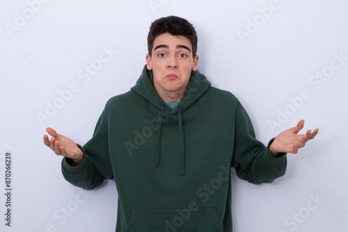 isolated teenager boy with expression of incomprehension or surprise