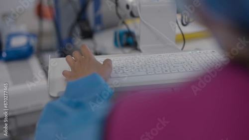 Closeup view of typing on keyboard of a health monitor in French hospital. photo