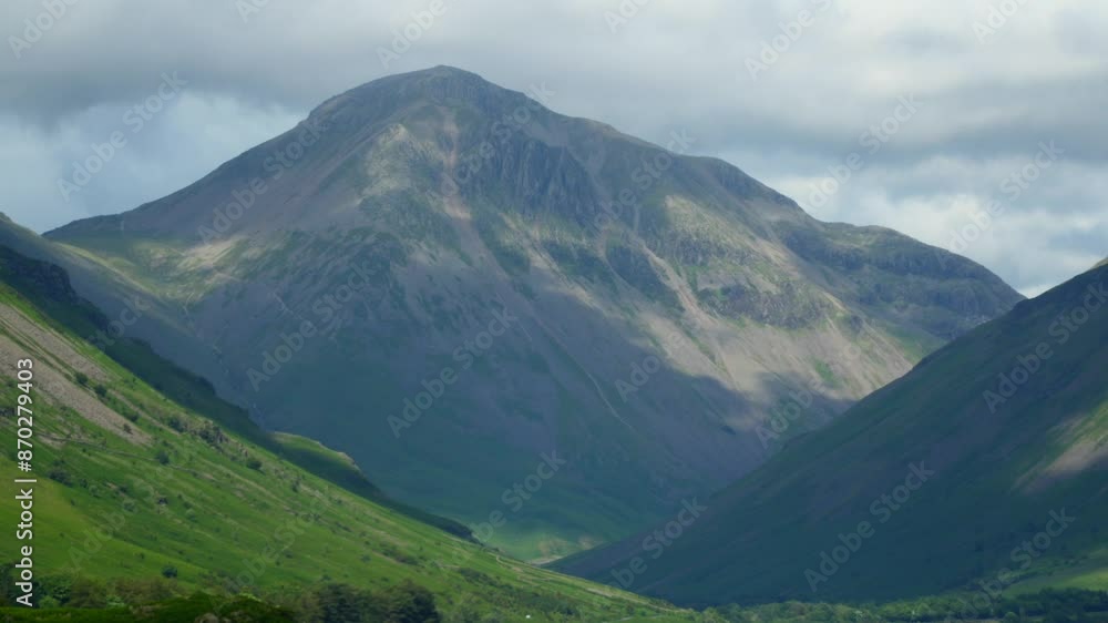 Shadows racing across mountain Great Gable and hilly countryside as thick cloud skims mountaintop. Timelapse 30x. Wasdale, English Lake District, UK Shadows racing across mountain Great Gable and hilly countryside as thick cloud skims mountaintop. Timelapse 30x. Wasdale, English Lake District, UK