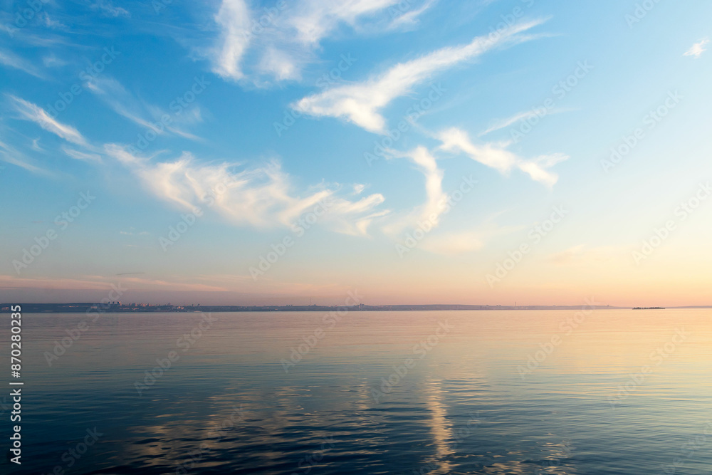 Naklejka premium Beautiful sky-water summer landscape on an evening June day in Karelia, the time of white nights.