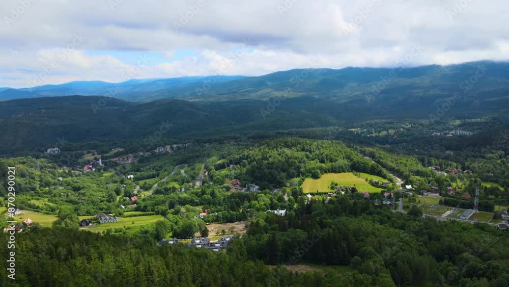 Aerial view of a village in the mountains forest of Germany on a sunny day Aerial view of a village in the mountains forest of Germany on a sunny day