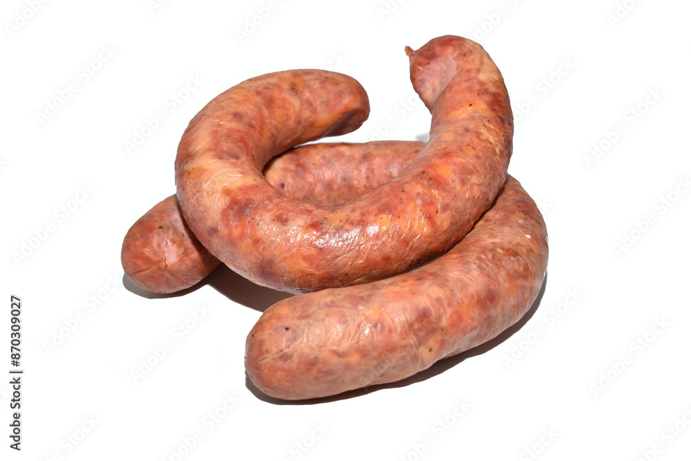 On a white background lies a sausage made from pork meat with the addition of garlic. On a white background lies a sausage made from pork meat with the addition of garlic.