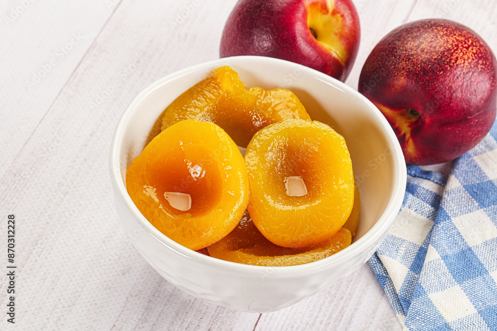 Canned peaches with sweet syrope Canned peaches with sweet syrope