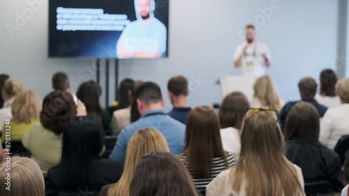 Wallpaper Mural Group of people attentively listening to a speaker at a business conference. Attendees are taking notes and recording the presentation. Torontodigital.ca