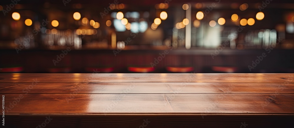 In the foreground, an empty wooden table with a clear surface, while the bar interior fades into the background, providing copy space image. In the foreground, an empty wooden table with a clear surface, while the bar interior fades into the background, providing copy space image.
