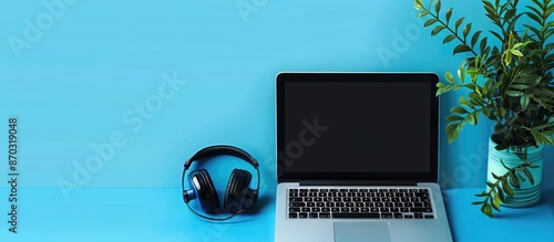 Blue background desk with a...