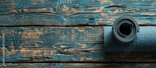 Vintage yoga mat placed aga...