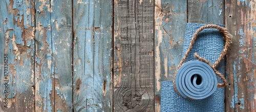 Vintage yoga mat placed aga...