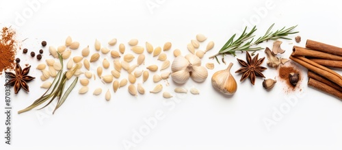 Top-down view of assorted dry spices like ginger, garlic, rosemary, and bay leaves on a white background, perfect for adding text or elements - copy space image.