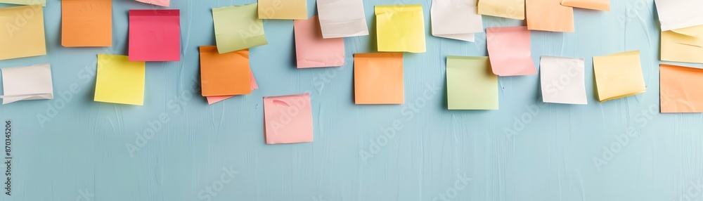 Colorful sticky notes on a blue wall. Colorful sticky notes on a blue wall.