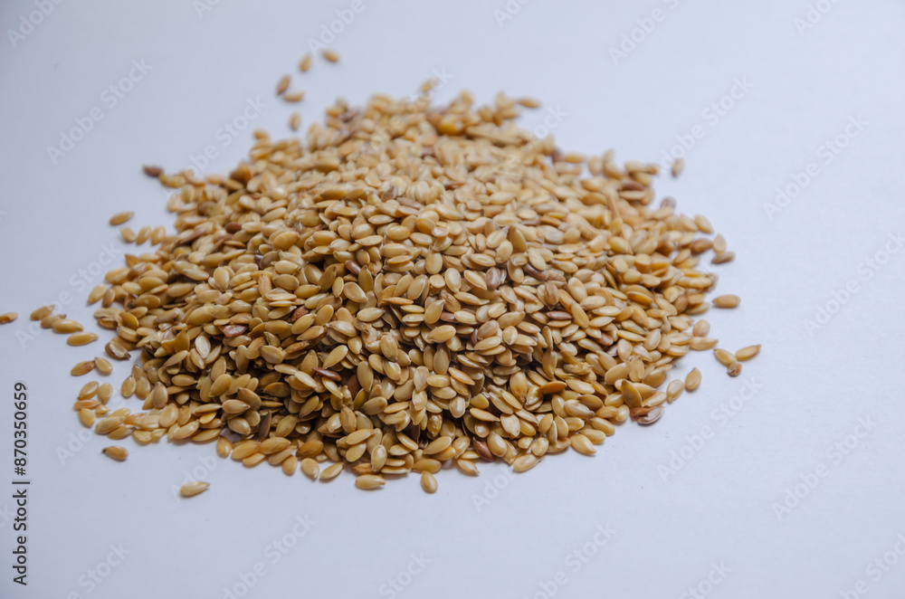 White flax seeds on a white background White flax seeds on a white background