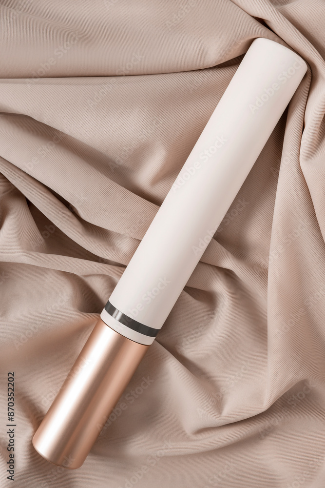 Naklejka premium Mascara tube on fabric