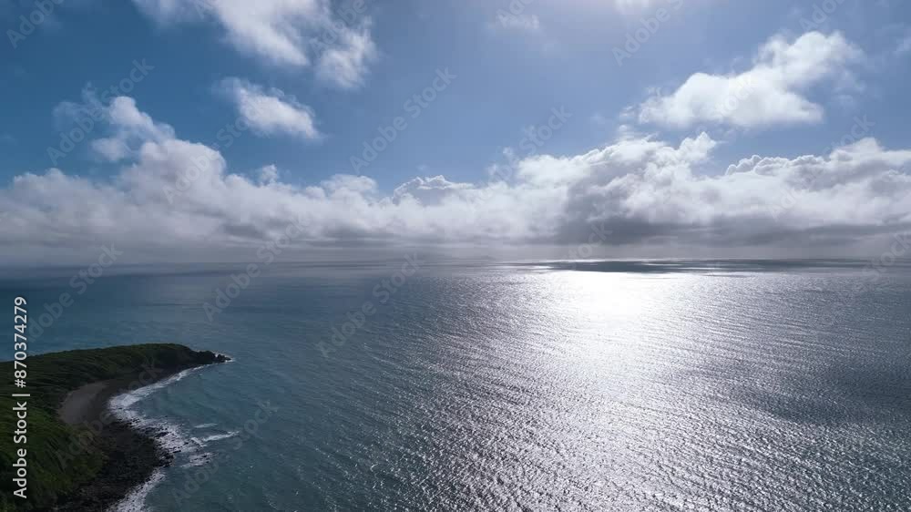 Aerial pans across the dazzling waters and cloud forms of the MacKay Coast in Queensland Australia. Shows the magnitude and serenity of the Coral Sea and tropical island coastline. Aerial pans across the dazzling waters and cloud forms of the MacKay Coast in Queensland Australia. Shows the magnitude and serenity of the Coral Sea and tropical island coastline.