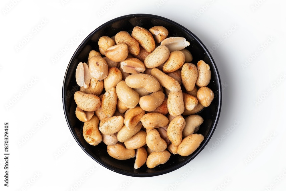 Paprika peanuts in black bowl whole and broken top view. Paprika peanuts in black bowl whole and broken top view.