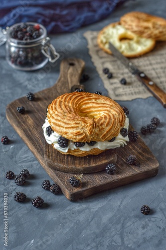 Eclair ring with blackberries on the table