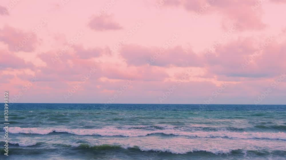 Ocean Waves and Amazing Colorful Pink Yellow Sunset Sky with Puffy Lilac Pink Clouds. Vacation, Relax, Beauty, Planet, Travel. Sky Clouds and Sea Waves at Sunrise. Ocean Waves and Amazing Colorful Pink Yellow Sunset Sky with Puffy Lilac Pink Clouds. Vacation, Relax, Beauty, Planet, Travel. Sky Clouds and Sea Waves at Sunrise.
