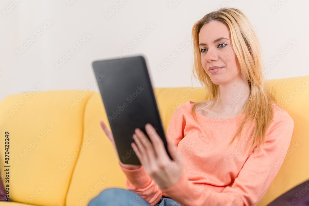 Portait of an attractive girl surfing the web on her tablet Portait of an attractive girl surfing the web on her tablet