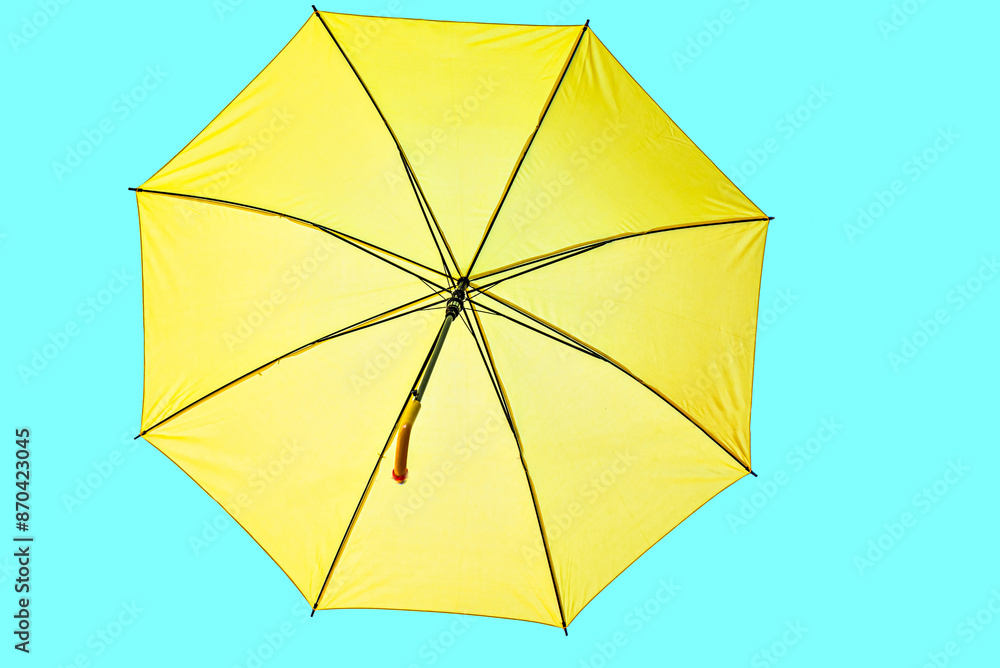 Open yellow umbrella on turquoise background Open yellow umbrella on turquoise background