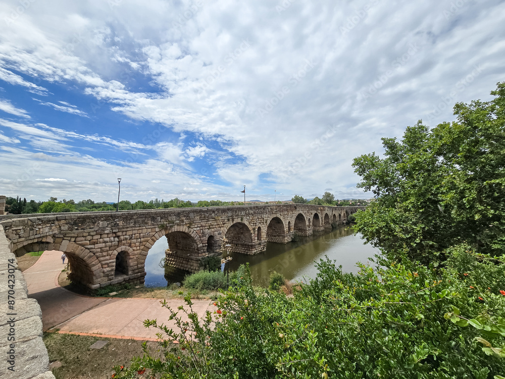 Fototapeta premium Historic roman bridge over the Guadiana river in Merida, Spain