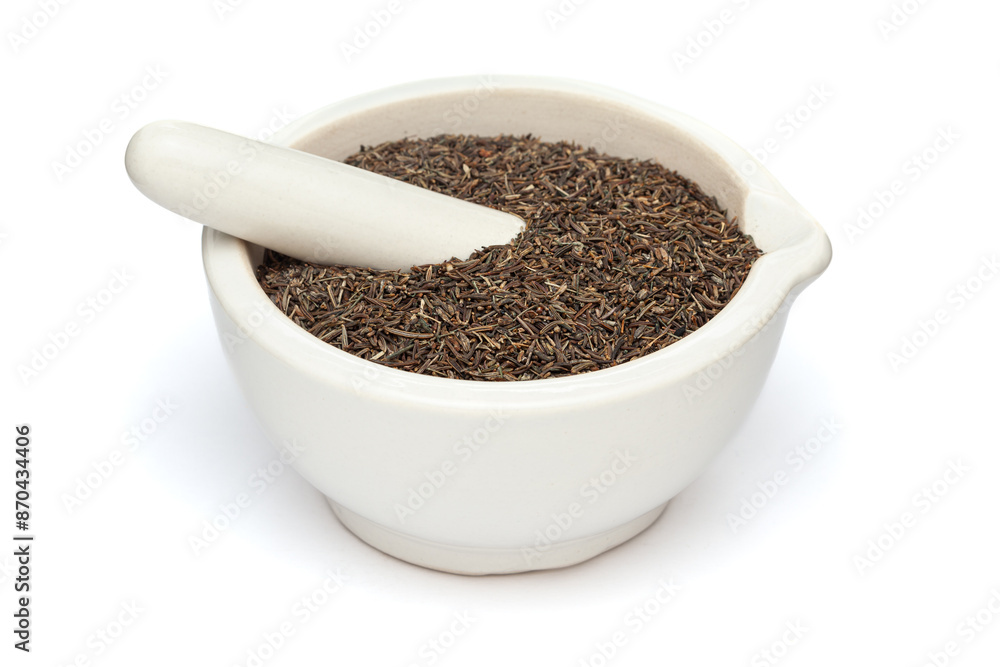 Close-up of Dry Organic Caraway (Bunium persicum) seeds or Syahi Jeera, in white ceramic mortar and pestle, isolated on a white background. Close-up of Dry Organic Caraway (Bunium persicum) seeds or Syahi Jeera, in white ceramic mortar and pestle, isolated on a white background.